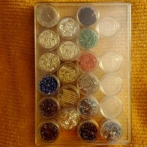 Assortment of 18 containers of beads